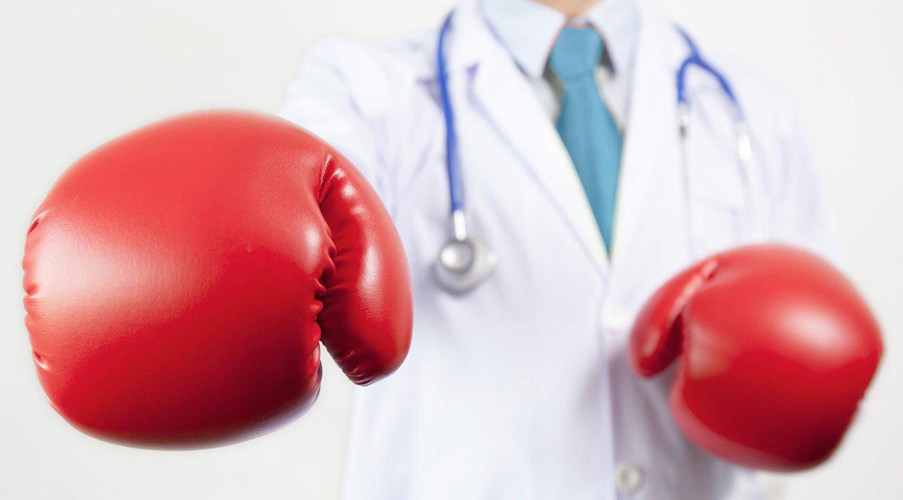 Doctor wearing boxing gloves