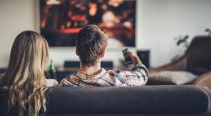 Couple streaming movie on couch